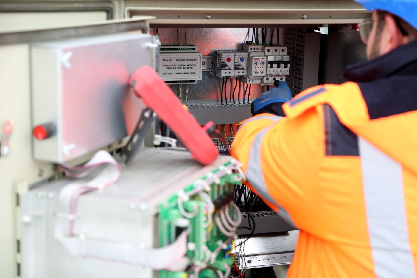 Engineer inspecting industrial electrical circuits