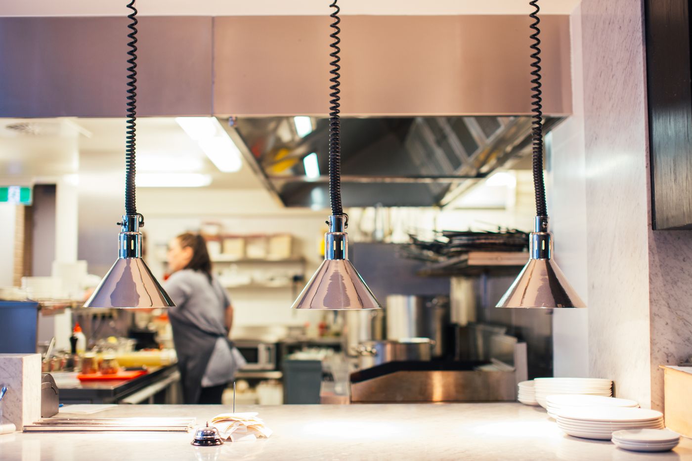 Chef working in a busy commercial restaurant kitchen